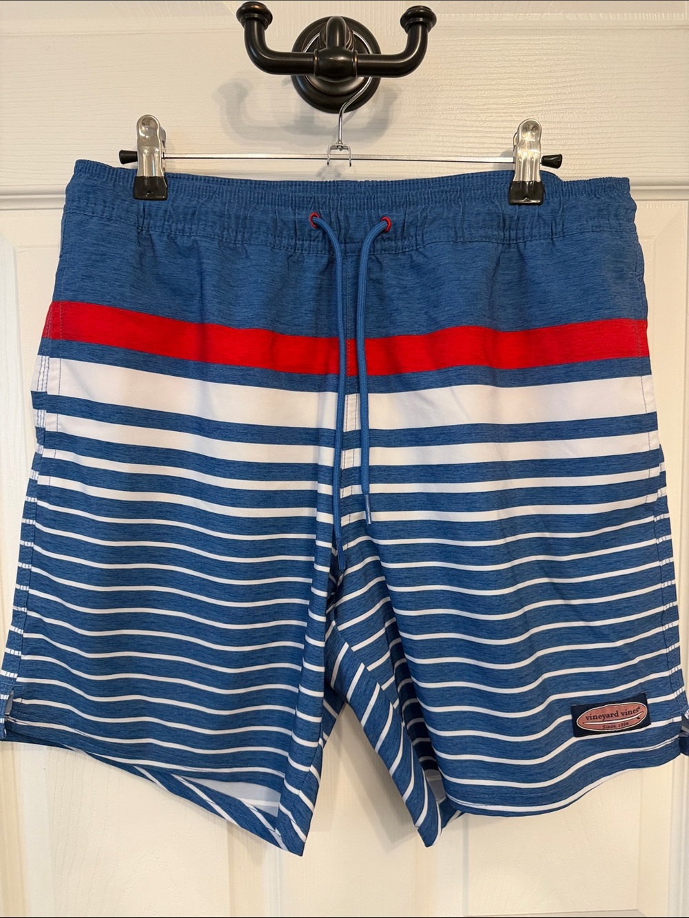 Vineyard Vines 7 inch swim trunks. Sz S. Red, white and blue striped design.